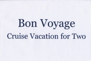 A white sheet with the words bon voyage written in blue.